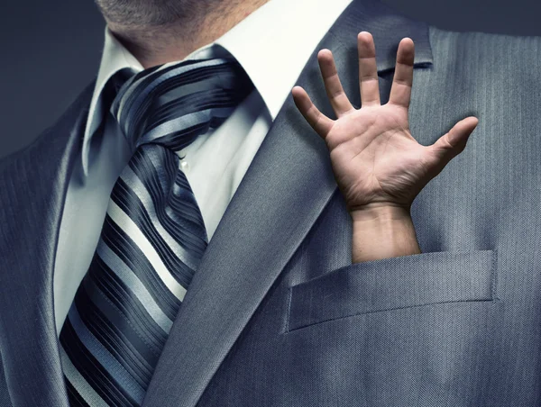 Uomo d'affari con mano umana — Foto Stock