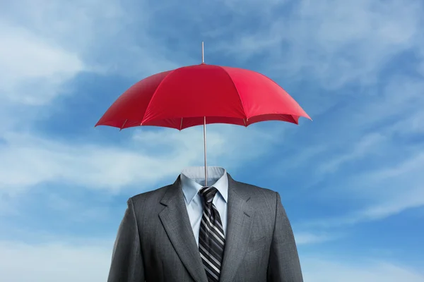 Businessman without head under umbrella — Stock Photo, Image