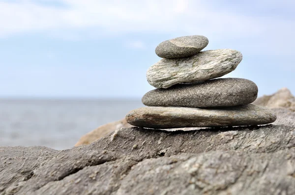 Piled stones on rock — Stock Photo, Image