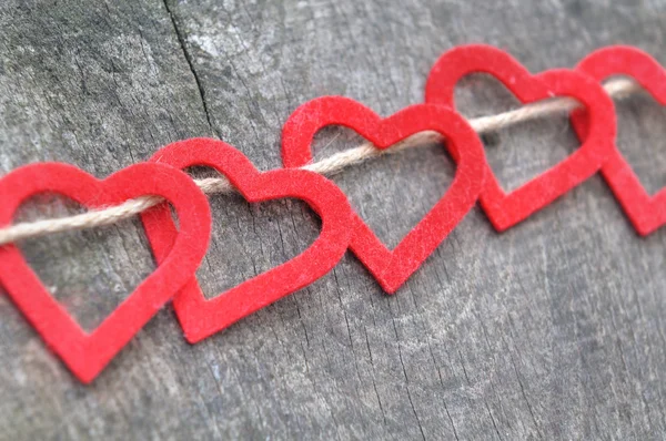 Red heart passed on a rope — Stock Photo, Image