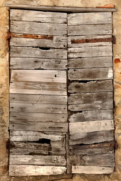 Closed shutter on old building — Stock Photo, Image