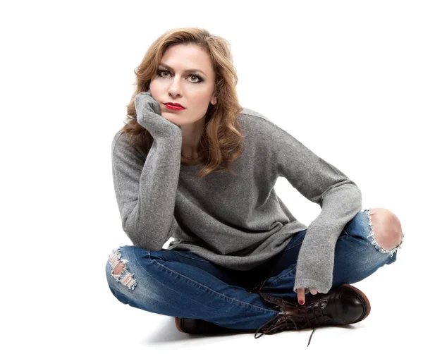 Beautiful blond woman sitting on floor — Stock Photo, Image