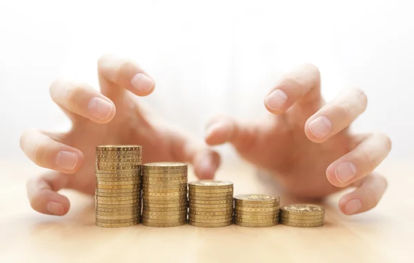 Greed for money. Hands grabbing coins. — Stock Photo, Image