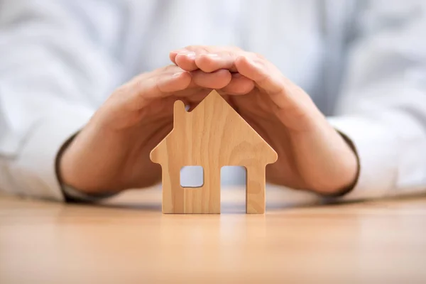 Wooden Toy House Protected Hands Home Insurance Concept — Stock Photo, Image