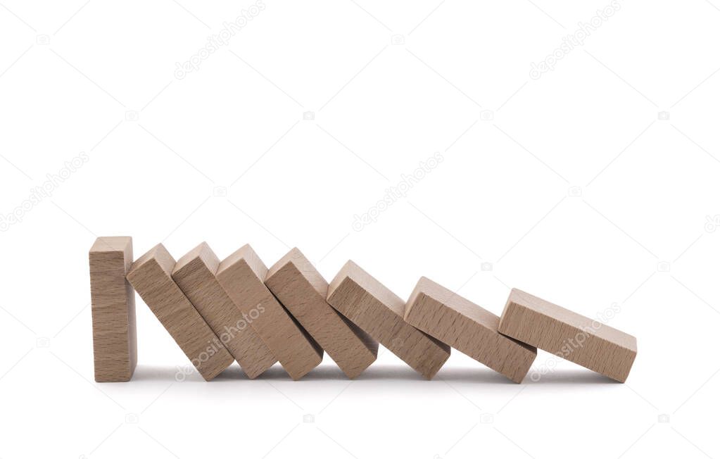 The domino effect stopped by a unique, one strong piece isolated on white with clipping path