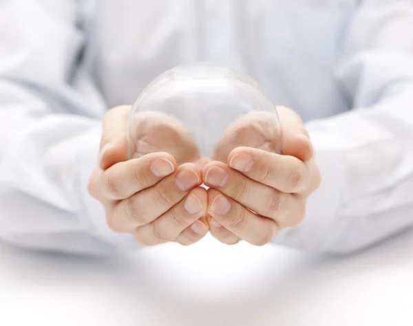 Crystal ball in hands — Stock Photo, Image