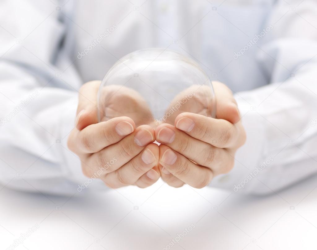 Crystal ball in hands