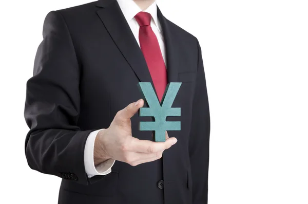 Businessman holding yen sign with clipping path — Stock Photo, Image