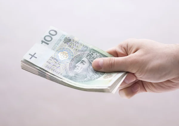 Pools geld in de hand — Stockfoto