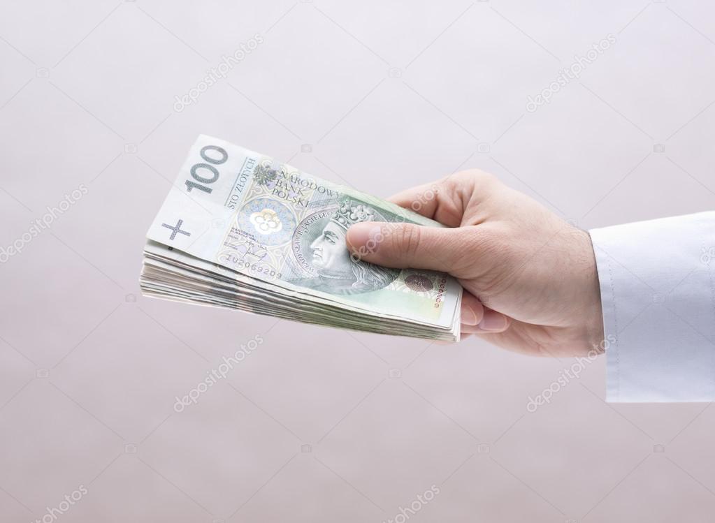 Polish money in hand
