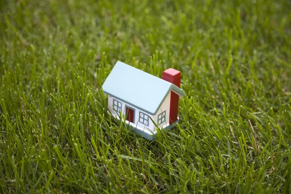 Little house on green grass — Stock Photo, Image