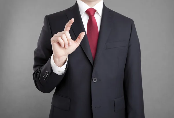 Empresário tocando ou segurando algo — Fotografia de Stock