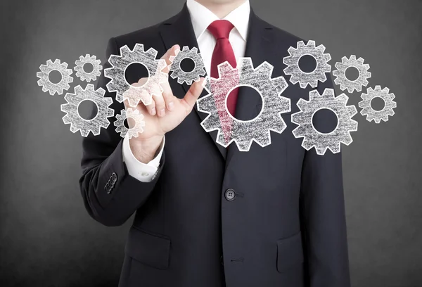 Businessman with gears, concept of well organized work process. — Stock Photo, Image