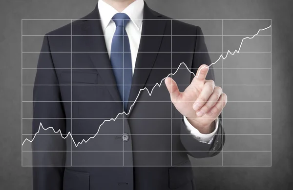 Businessman with growing chart — Stock Photo, Image