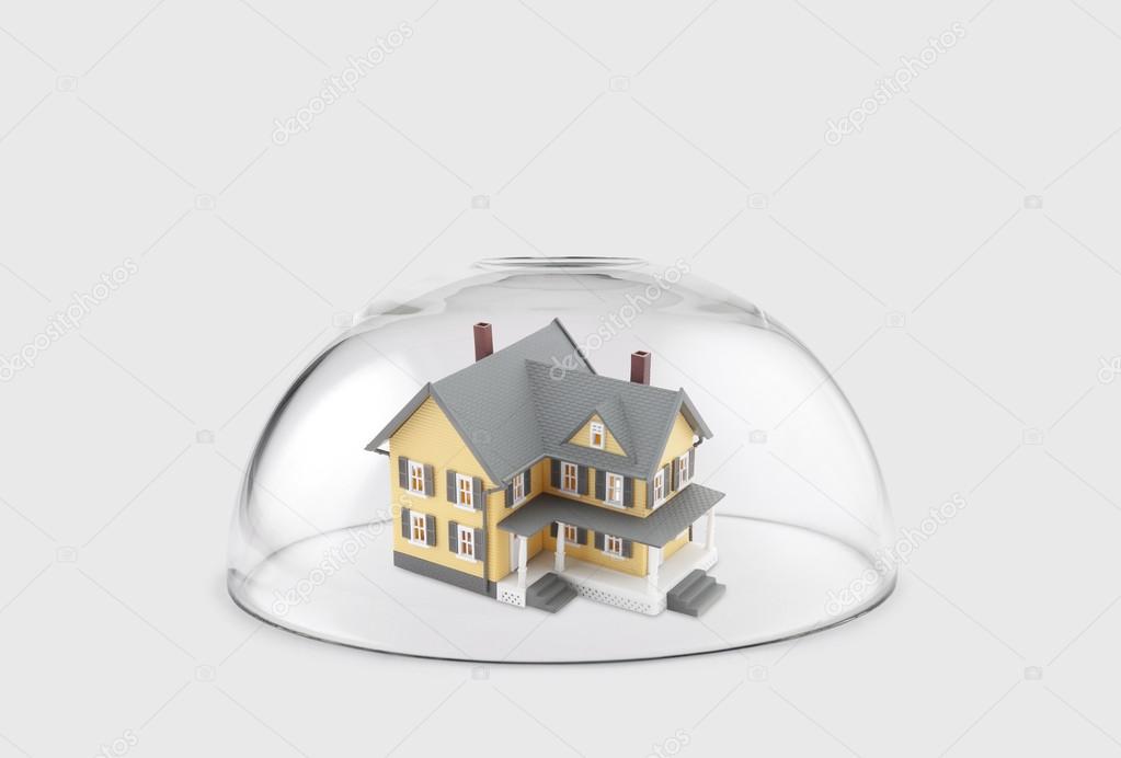 House protected under a glass dome