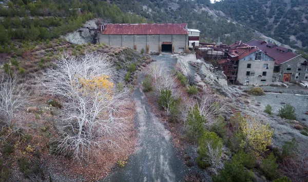 Abandoned factory buildings of former asbestos mine and colorful autumn landscape of Amiantos, Cyprus. Aerial view