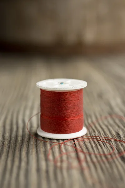 Red spool of thread — Stock Photo, Image