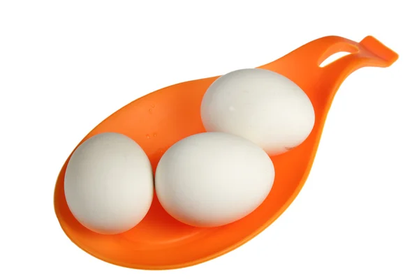 Jaja na pomarańczowy pomoc — Zdjęcie stockowe