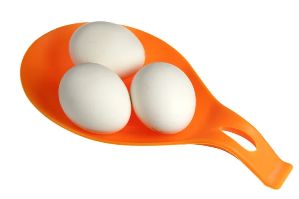 Jaja na pomarańczowy pomoc — Zdjęcie stockowe