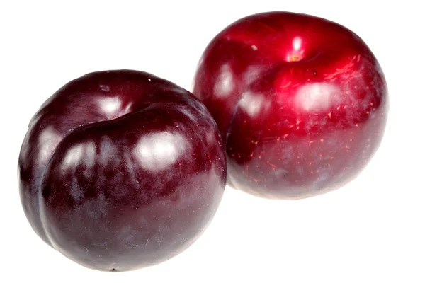 Plums it is isolated on a white background — Stock Photo, Image