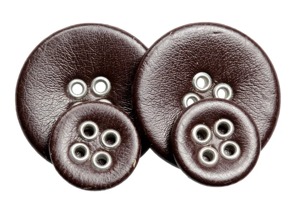 Botões de couro sobre um fundo branco — Fotografia de Stock