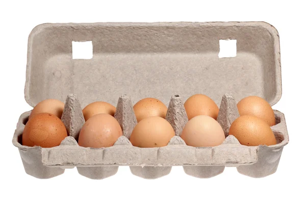 Ovos em embalagens de fundo branco — Fotografia de Stock