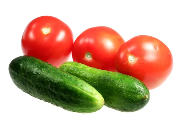 Cucumbers and tomatoes on a white background — Stock Photo, Image