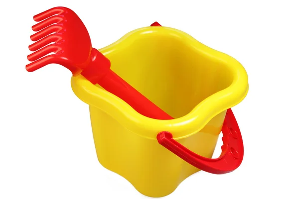 Plastic bucket and rake — Stock Photo, Image