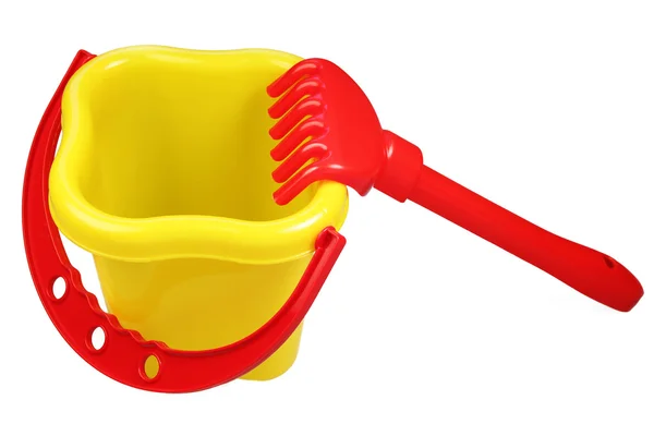 Plastic bucket and rake — Stock Photo, Image
