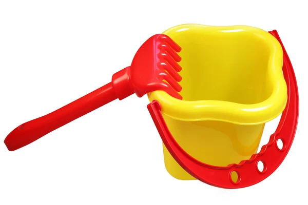 Plastic bucket and rake — Stock Photo, Image