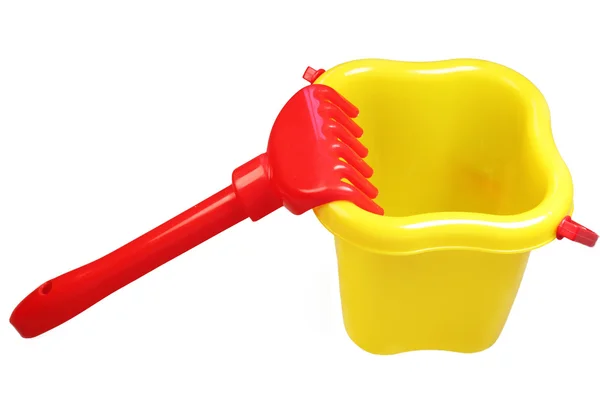 Plastic bucket and rake — Stock Photo, Image