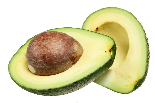 Avocado doormidden gesneden op een witte achtergrond — Stockfoto