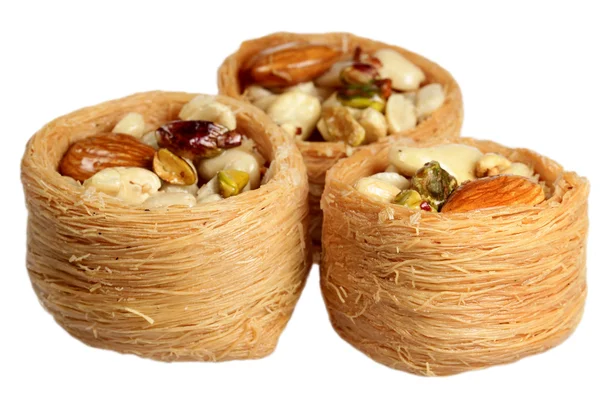 Nest with nuts on a white background — Stock Photo, Image