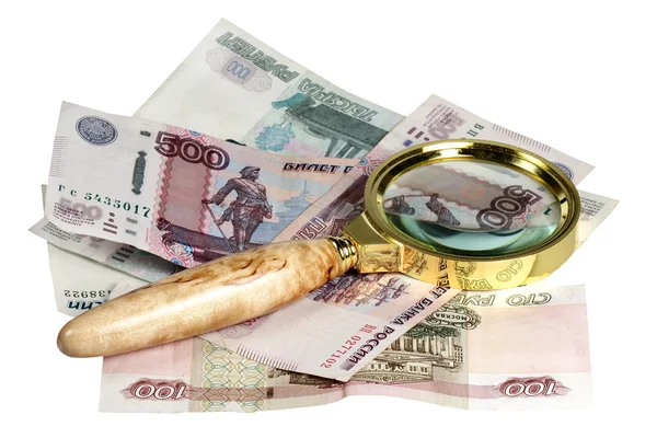 The Russian money and magnifying glass on a white background — Stock Photo, Image