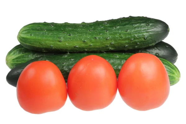 Cucumbers and tomatoes on a white background — Stock Photo, Image