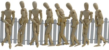 Birkaç kişi çitin önünde sırada bekliyor.