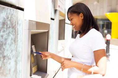 young woman at the cash machine clipart