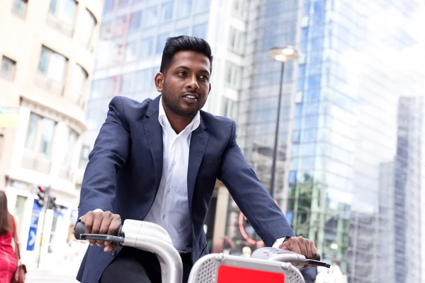 Indian business man riding his bike — Stock Photo, Image