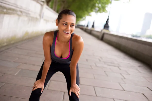 Fitness woman exercising in london — Stock Photo, Image