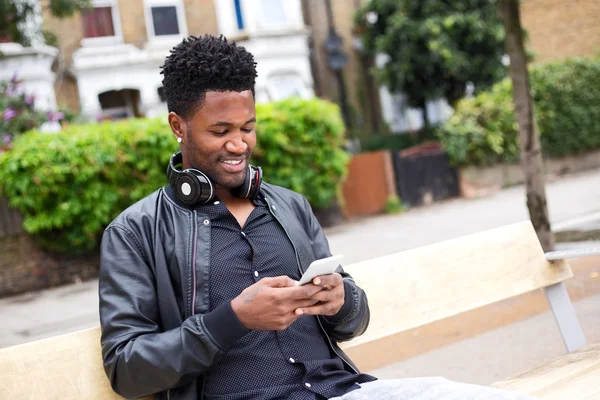 Young man reading his text messages — Stock Photo, Image