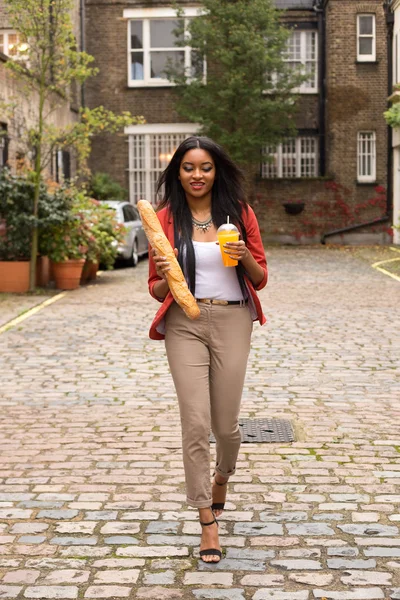 Woman with baguette — Stock Photo, Image