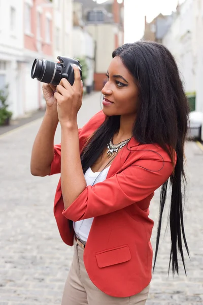 Girl with a camera — Stock Photo, Image