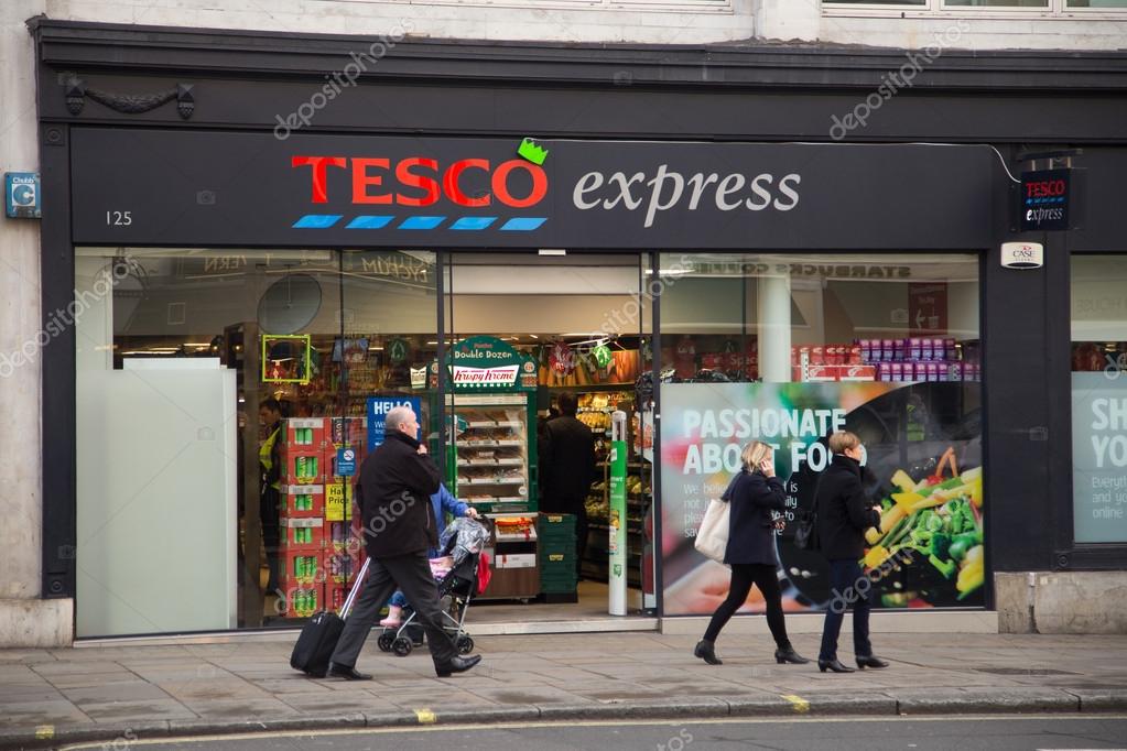 LONDON - DECEMBER 11TH: The exterior of an Tesco's express supermarket on December the 11th, 2014, in London, England, UK. Tesco's is one of the UK's leading supermarkets.
