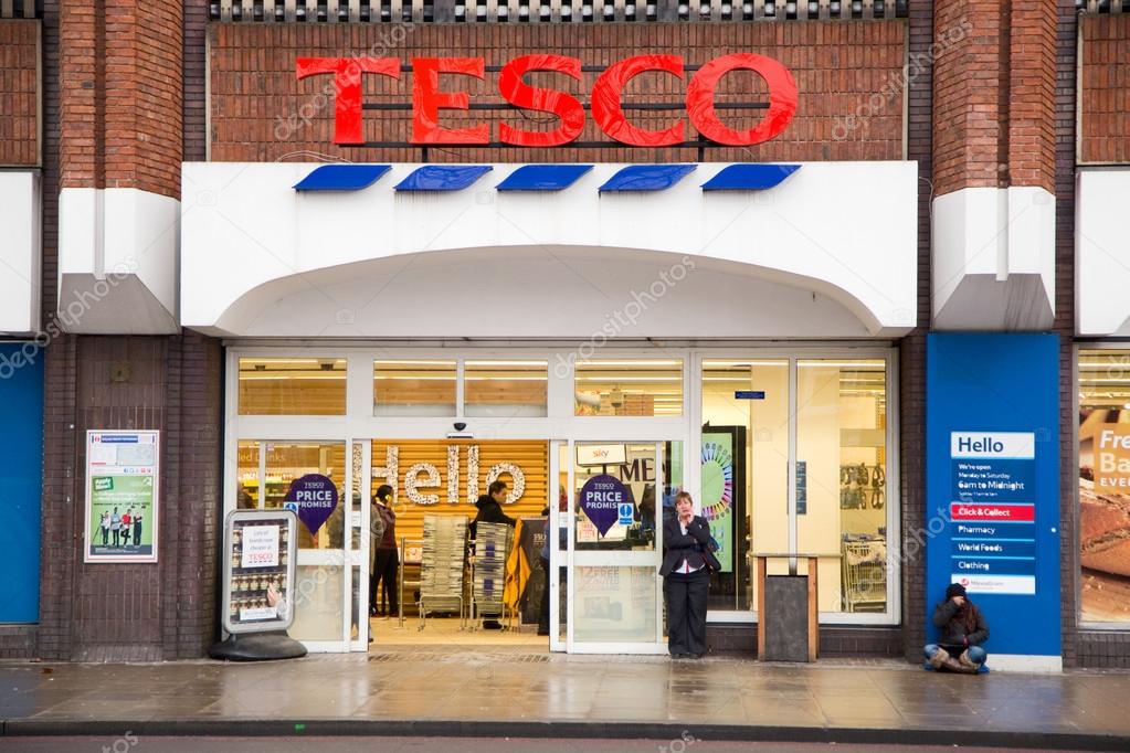 LONDON - JANUARY 21ST: The exterior of an Tesco's express supermarket on January the 21tst, 2015, in London, England, UK. Tesco's is one of the UK's leading supermarkets.