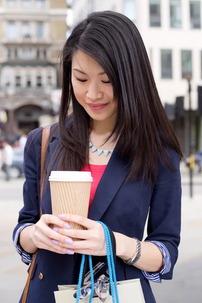 Young chinese woman with coffee — Stock Photo, Image