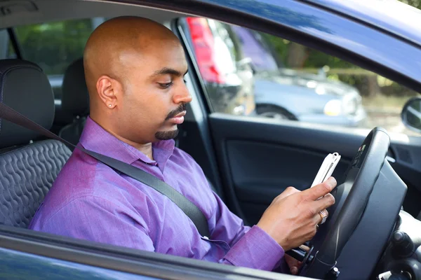 Texting in car — Stock Photo, Image