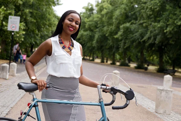 Young woman with a bike — Stock Photo, Image