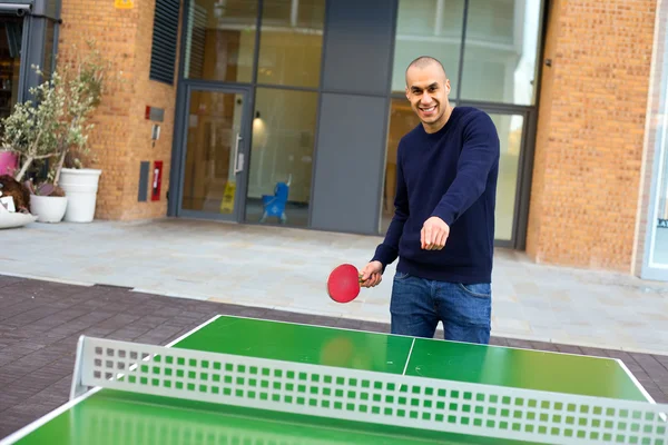 Young man playing ping pong — Stock Photo, Image