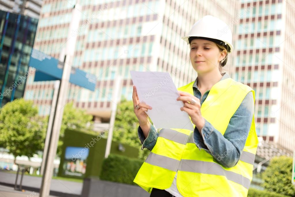 construction worker reading a document