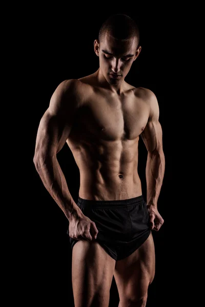 Fitness man isolated on black background — Stock Photo, Image